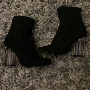 Black heeled booties with a clear heel